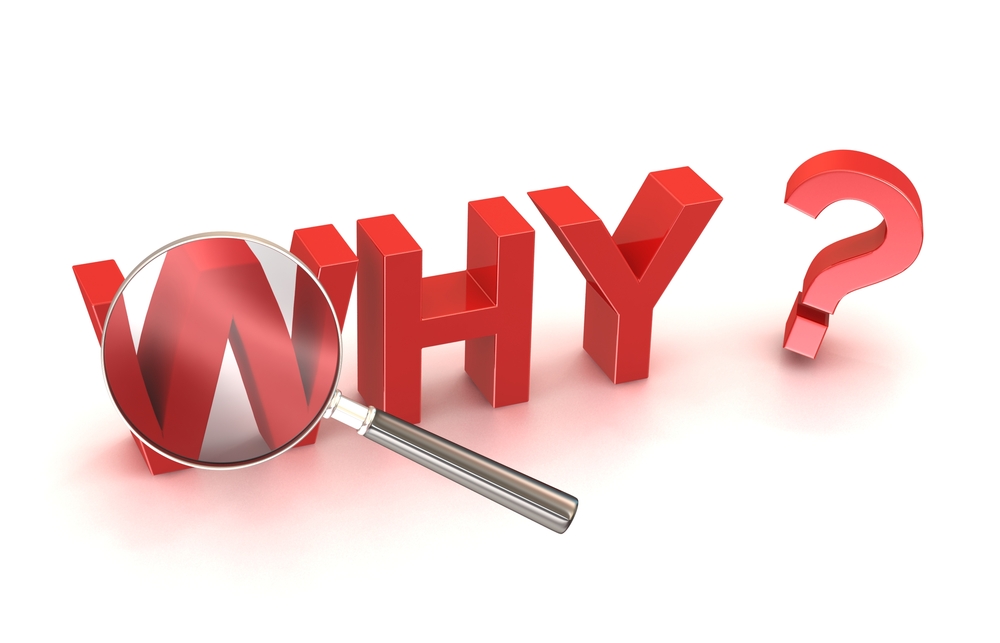 The Word "Why" in Red Block Letters with a Magnifying Glass